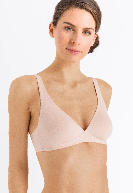 Lace bras for a feminine and elegant touch​ Hanro Cotton Sensation Soft Cup Wireless Bra in Beige